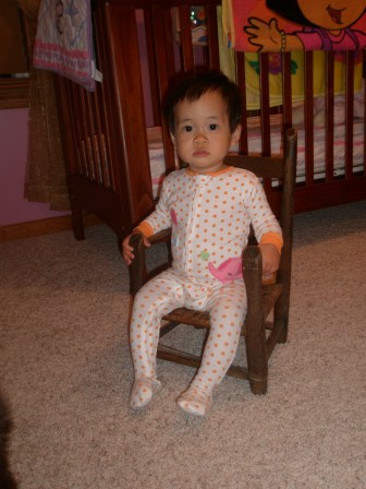 Karis sitting in her little chair